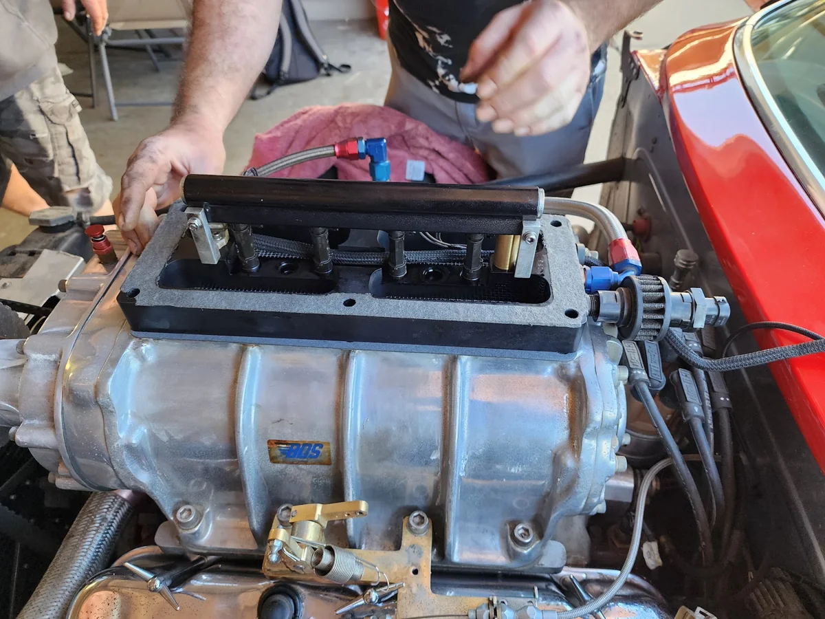 Exposed fuel rail and injector assembly inside the customer's blower hat